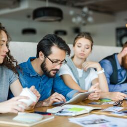 Young businessman networking among creative colleagues